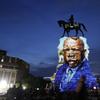 In this Wednesday, July 22, 2020 file photo, an image of the late Georgia Congressman and civil rights pioneer U.S. Rep. John Lewis is projected on to the pedestal of the statue of confederate Gen. Ro
