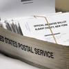 In this June 30, 2020, file photo, a box of absentee ballots wait to be counted at the Albany County Board of Elections in Albany, N.Y. Mail-in voting has gotten off to a rocky start in New York City.