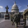 National Guard troops reinforce security around the U.S. Capitol ahead of expected protests leading up to President-elect Joe Biden's inauguration, in Washington, Sunday, Jan. 17, 2021.