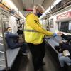 Patrick Foye, Chairman and CEO of the Metropolitan Transportation Authority, hands out face masks on a New York subway, Tuesday, Nov. 17, 2020. 