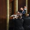 U.S. Capitol Police with guns drawn stand near a barricaded door as protesters try to break into the House Chamber at the U.S. Capitol on Wednesday, Jan. 6, 2021, in Washington. 