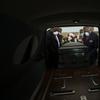 In this Saturday, April 18, 2020 file photo, mortician Cordarial O. Holloway, foreground left, funeral director Robert L. Albritten, foreground right, place a casket into a hearse in Dawson, Ga.