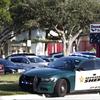 A Broward County Sheriff's Office vehicle is parked outside Marjory Stoneman Douglas High School, in Parkland, Fla. 