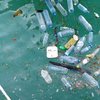 plastic water bottles and other debris floating in the ocean