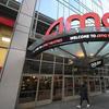 A pedestrian walks by the newly reopened AMC 34th Street theater on March 5, 2021, in New York. 