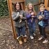 Members of the Abta family, from left, Allison, Violet, Eli, and Ariella hold hens in front of their backyard chicken run in Ross, Calif., on Dec. 15, 2020.