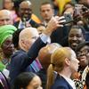 President Joe Biden takes a selfie with members of the audience after speaking during a visit to a mobile COVID-19 vaccination unit at the Green Road Community Center in Raleigh, N.C., Thursday.