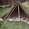 A classic WWII-style tent is perfect for backyard camping.