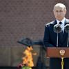 Russian President Vladimir Putin stands at a podium giving a speech to Russian WWII veterans marking the 80th anniversary of the Nazi attack on the Soviet Union. 