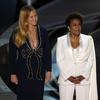 Hosts Amy Schumer, from left, Wanda Sykes, and Regina Hall appear on stage at the Oscars on Sunday, March 27, 2022, at the Dolby Theatre in Los Angeles.