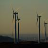 Wind turbines work on hills in Livermore, Calif., on Wednesday, Aug. 10, 2022