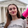 Grace Rykaczewski, 21, of Morristown, N.J., poses for a portrait as she demonstrates against abortion, Saturday, May 14, 2022, outside the Supreme Court in Washington.