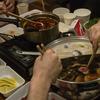 Dishes of food arranged on a tabletop.
