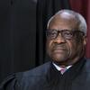 Associate Justice Clarence Thomas joins other members of the Supreme Court as they pose for a new group portrait, at the Supreme Court building in Washington, Oct. 7, 2022. 