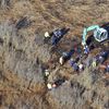 In this Dec. 8, 2011 photo, investigators use a backhoe to dig while searching for Shannan Gilbert's body in different sectors of a marsh area just east of Oak Beach, N.Y. A Long Island architect has 