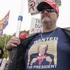 A supporter of former President Donald Trump protests at E. Barrett Prettyman U.S. Federal Courthouse, Thursday, Aug. 3, 2023, in Washington.