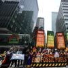 Climate activists block traffic on Park Avenue during a march protesting energy policies and the use of fossil fuels, in New York, Sunday, Sept. 17, 2023. 