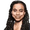 Suzan-Lori Parks posing for a headshot in a black shirt.