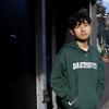 TaoHeng Chen, a Radio Rookies participant, poses for a portrait in Chinatown.