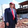 Republican presidential nominee, former U.S. President Donald Trump, listens to a question as he visits Chez What Furniture Store which was damaged during Hurricane Helene on September 30, 2024 in Val