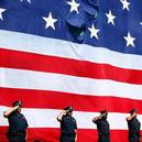 Members of the Boston Police Department line up during a pregame ceremony at Fenway Park remembering first responders from 9/11. Sept. 10, 2014
