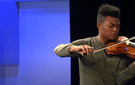 Randall Goosby playing the violin