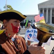 A tea-party supporter protest outside the US Supreme Court on the third day of oral arguements over the constitutionality of the Patient Protection and Affordable Care Act