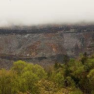 Surface mining operations are seen beneath low lying clouds in the Appalachian Mountains on April 18, 2012 in Partridge, Kentucky.