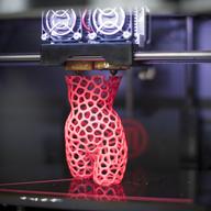 A 3-D printer creates a sculpture of a woman at the DMY International Design Festival at the former Tempelhof Airport Hangar on June 5, 2013 in Berlin, Germany.