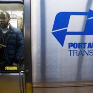 Commuters exit a PATH train at the World Trade Center station. Manhattan, mass transit, train station, 