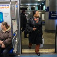 Commuters board a PATH train toward Newark at the Journal Square station in New Jersey. New York City, Manhattan, NJ, 