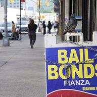 Offices advertising bail bonds across the street from the Bronx Family Court. 
