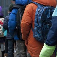 The many backpacks of students in line outside PS234 elementary school in lower Manhattan.