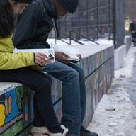 Students study in the cold outside Stuyvesant High School in Manhattan.