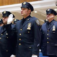 Officers practice taking their oaths prior to an NYPD promotion ceremony at One Police Plaza. 