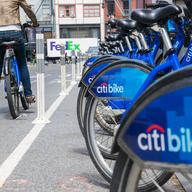 A woman checks a bike out from a Citi Bikes station in lower Manhattan.
