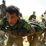 Shiite Muslim fighters, loyal to Iraqi Shiite cleric Moqtada al-Sadr, take part in a last combat training near the city of Najaf on August 23, 2014.