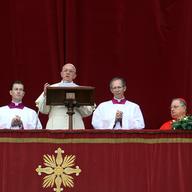 Pope Francis delivers his Christmas Day message from the central balcony of St Peter's Basilica on December 25, 2013 in Vatican City, Vatican.