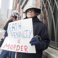 Joe Kebartas of South Boston protests the death penalty outside of the entrance to the John Joseph Moakley United States Courthouse during the first day of the Dzhokhar Tsarnaev trial on March 4, 2015