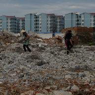 February 20, 2014. Construction of new high-rise apartments that will house villagers near the city of Anshun, Guizhou Province. 