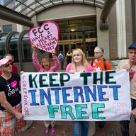 Protesters hold a rally to support 'net neutrality' and urge the FCC to reject a proposal that would allow Internet service providers to provide paid fast lanes for websites.