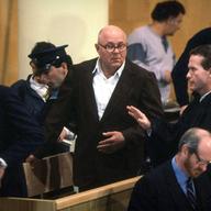 John Demjanjuk (C), 81-year-old retired auto worker living in Cleveland, OH, charged as a Nazi death camp guard, appears in a courtroom at the start of his trial February 16, 1987 in a Jerusalem.