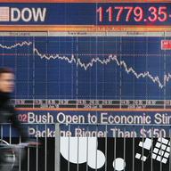  A cyclist passes a financial display screen showing the FTSE 100 on January 22, 2008 in West London. 