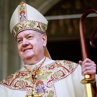 Cardinal Edward Egan smiles to the crowd after celebrating his final Easter mass as archbishop of New York April 12, 2009 