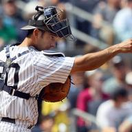 Jorge Posada #20 of the New York Yankees points to teammate pitcher Phil Hughes (not pictured) after a sixth inning strike out against the Chicago White Sox on May 2, 2010