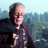 Columnist Jimmy Breslin poses in his New York apartment May 7, 2002.