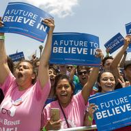 Supporters of Democratic presidential candidate Sen. Bernie Sanders, I-Vt., cheer him up as he speaks during a campaign rally at Ventura College in Ventura, Calif., Thursday, May 26, 2016.
