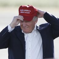In this June 1, 2016, file photo, Republican presidential candidate Donald Trump wears his 'Make America Great Again' hat at a rally in Sacramento, Calif. Trump’s “Make America Great Again” hats.