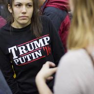 A woman wears a shirt reading 'Trump Putin '16' while waiting for Republican presidential candidate Donald Trump to speak at a campaign event at Plymouth State, N.H.