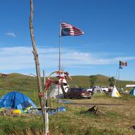 An American flag flies upside down in protest at an encampment near North Dakota's Standing Rock Sioux reservation on Friday, Sept. 9, 2016.